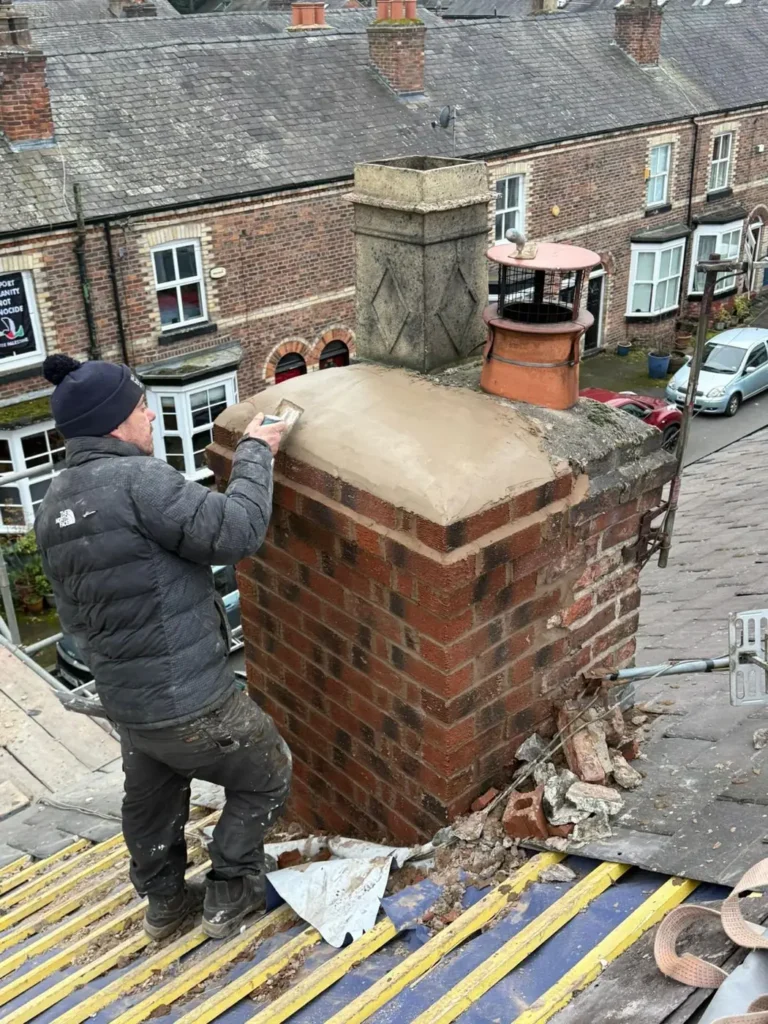 Roofer repairing a brick chimney stack