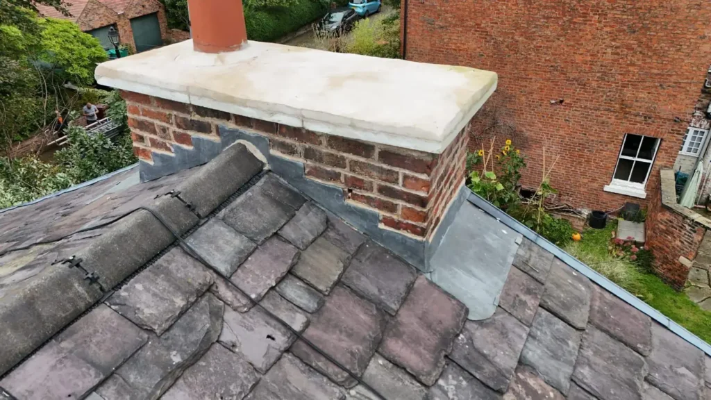 Rebuilt chimney with new coping stone and lead