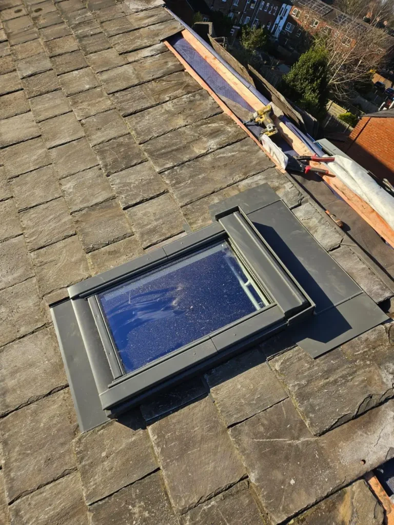 Roof window with lead flashing in a slate roof