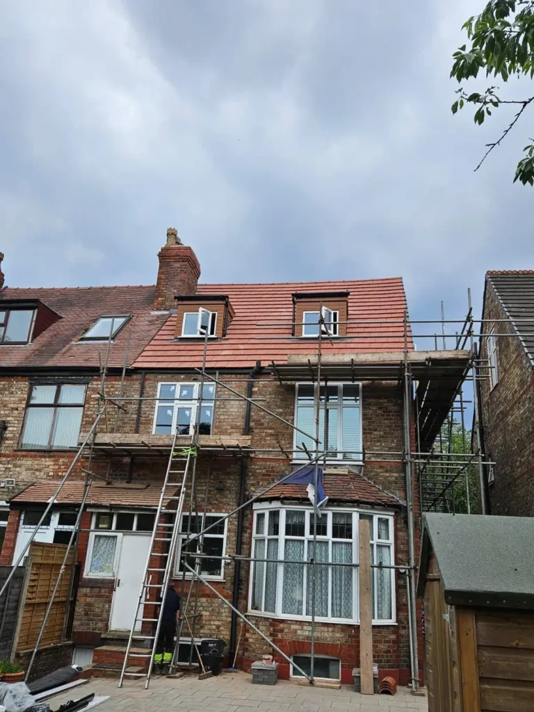 Rear of a house with scaffolding up for roof work