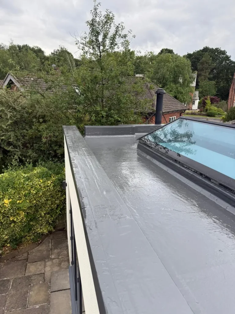 Finished grey flat roof with a rooflight