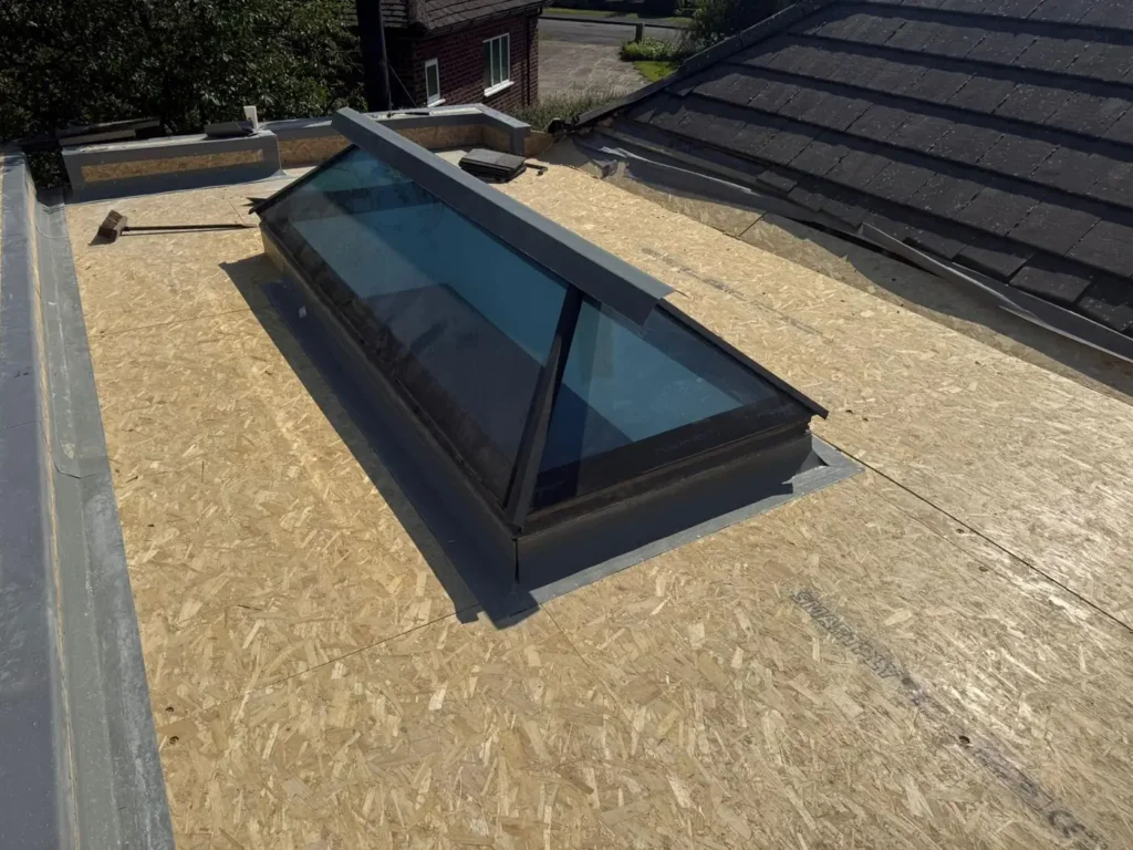 Flat roof deck prepared for a new rooflight