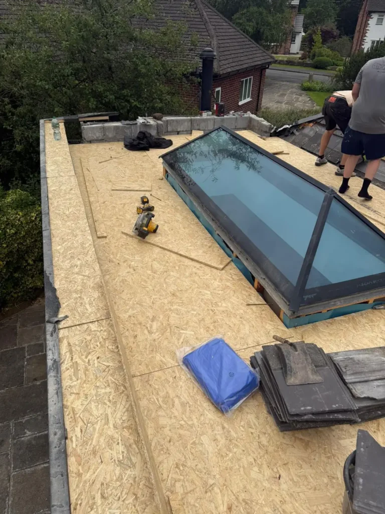Flat roof deck with rooflight being installed