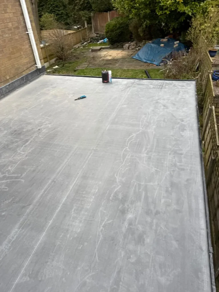 Completed flat roof with a smooth grey finish