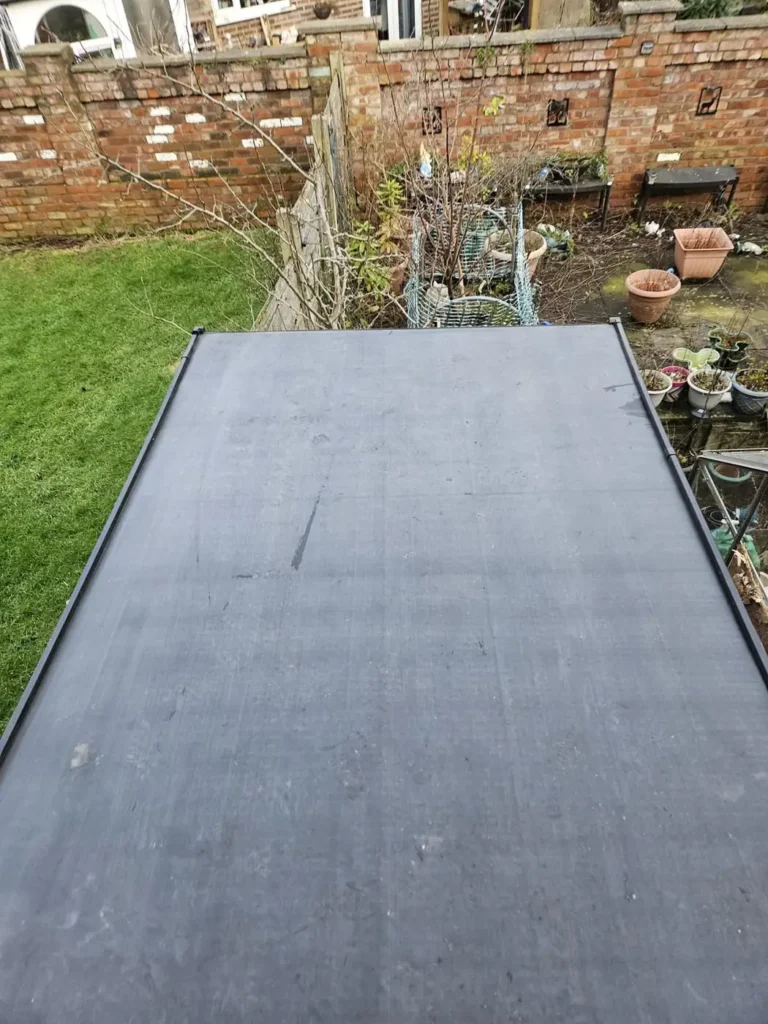 New black flat roof membrane on a rear extension