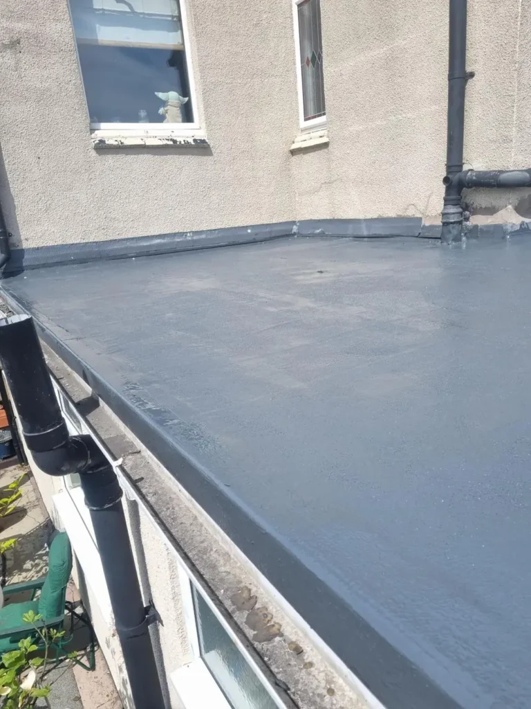 Finished grey flat roof with new edge trim