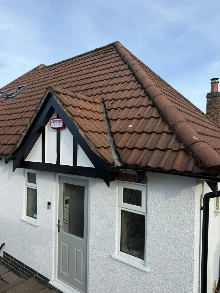 New red tiled roof on a white rendered bungalow