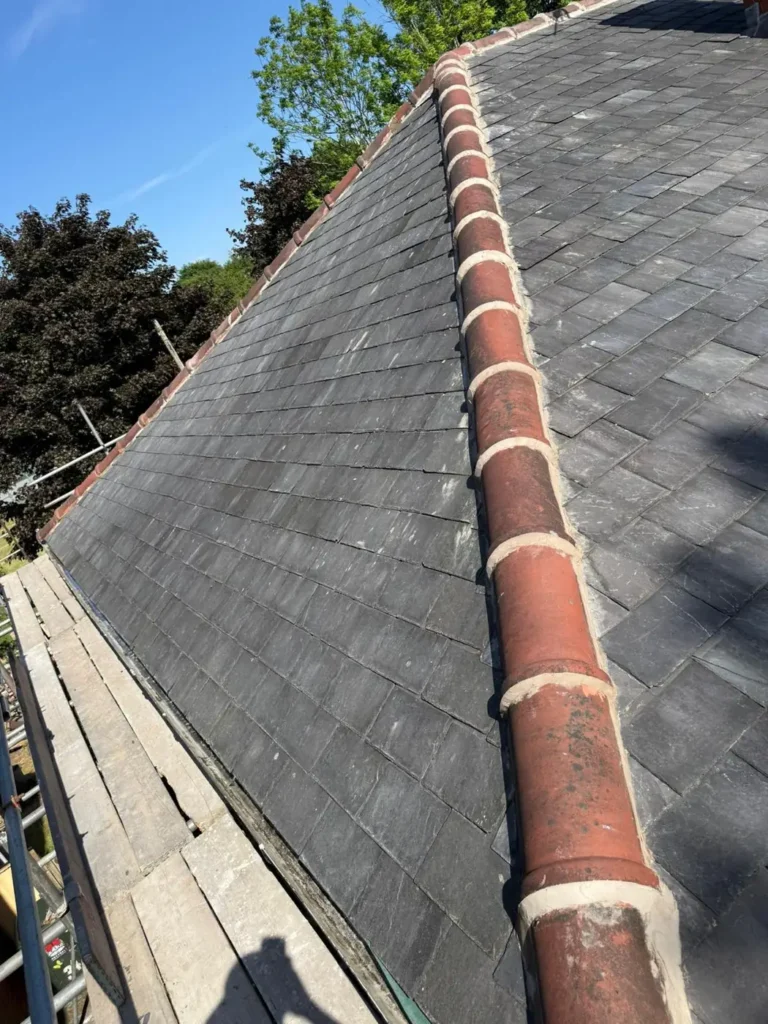 New slate roof with ridge tiles