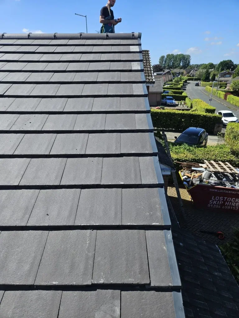 New grey tiled roof seen from the scaffold