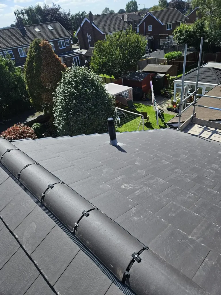 New slate-effect roof with ridge tiles
