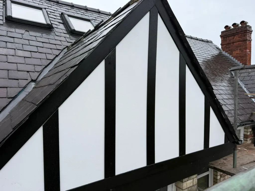 Black timber bargeboards on a mock-Tudor gable