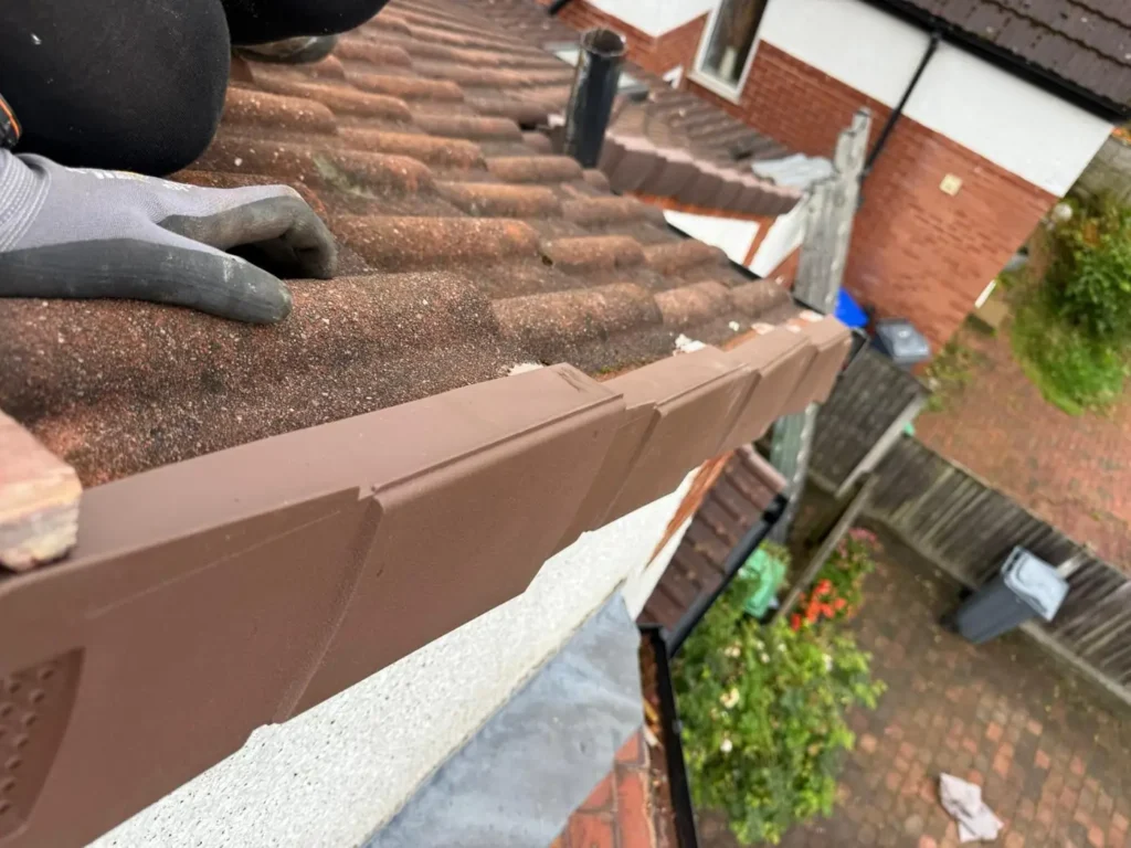 New brown fascia and soffit with guttering