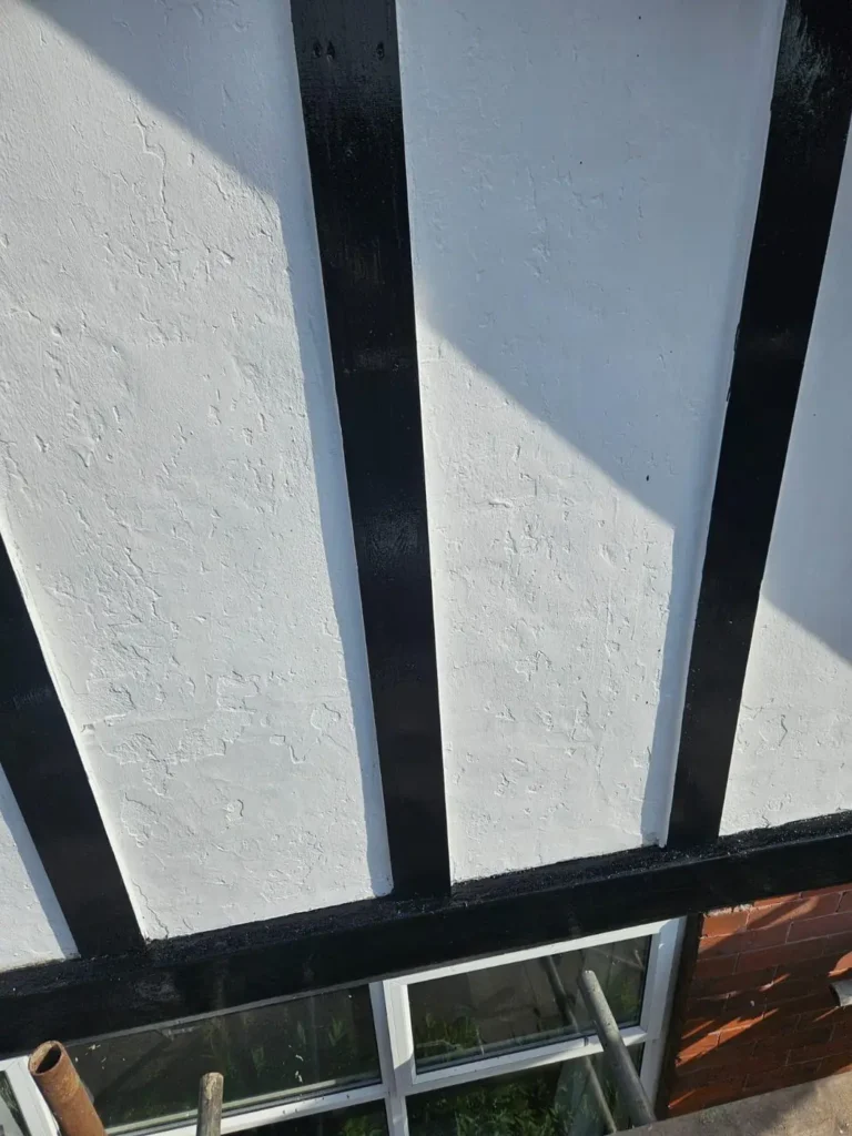 Black and white mock-Tudor gable finished
