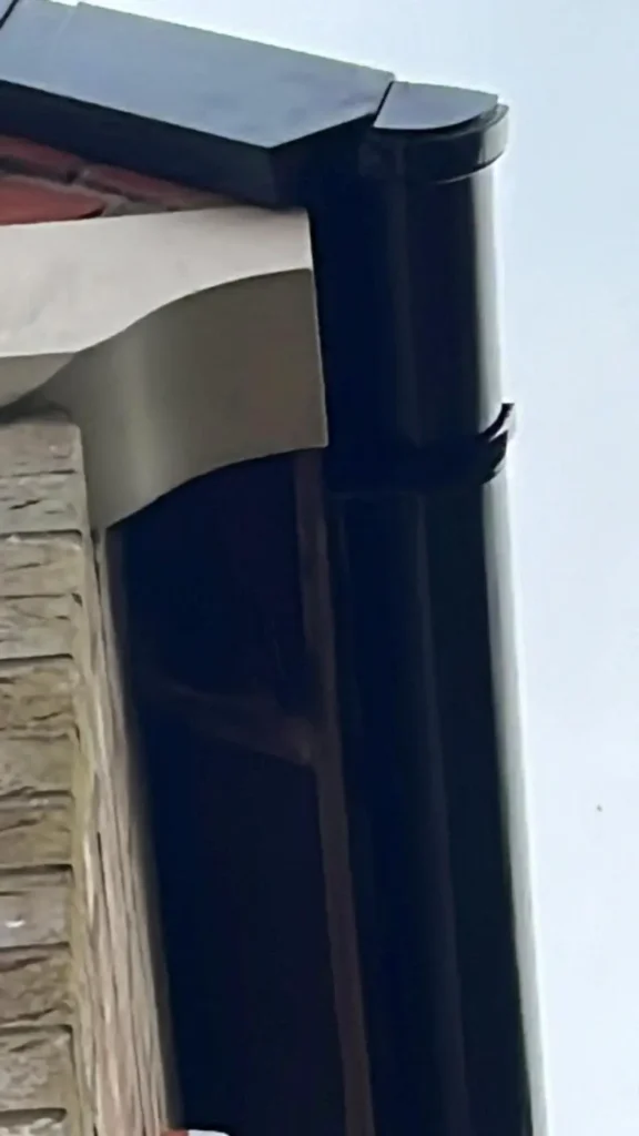 Black guttering and fascia corner detail