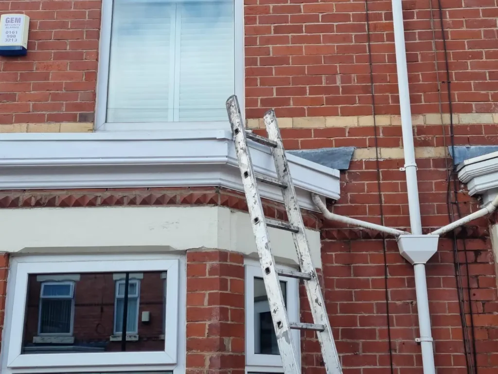 Bay window roofline with new guttering and downpipe